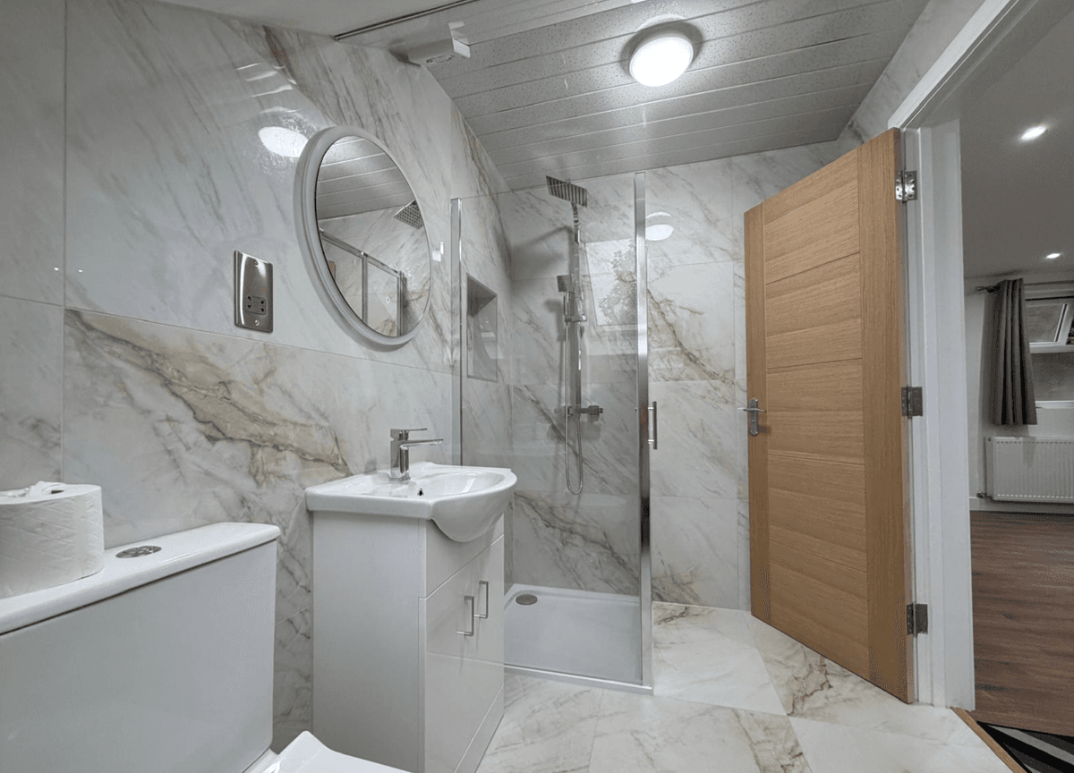 Marble shower room with door